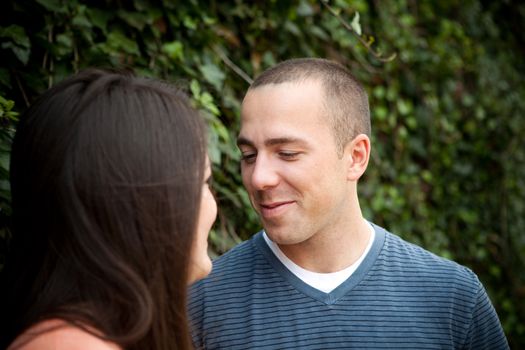 Young happy couple enjoying each others company outdoors.