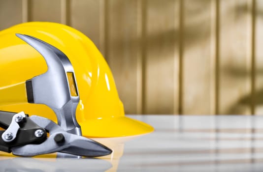 hammer and metall cutter with helmet