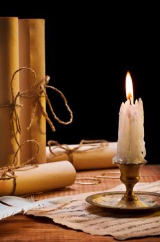 burning candle and antique items