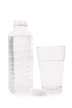 Composition from a transparent plastic bottle and a glass glass with water