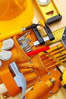 building tools in belt and hardhat
