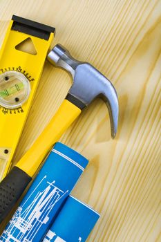 level hammer and blueprints
