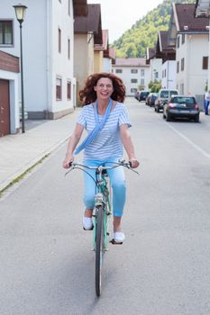 Mature woman riding a bicycle in the city