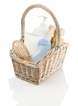 basket with tubes, hairbrush and masseur