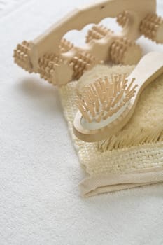 massager and hairbrush on bast