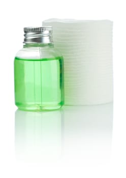 small bottle and cotton pads