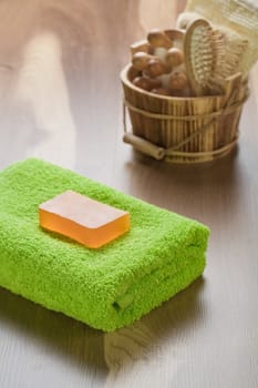 soap on towel with wooden bucket