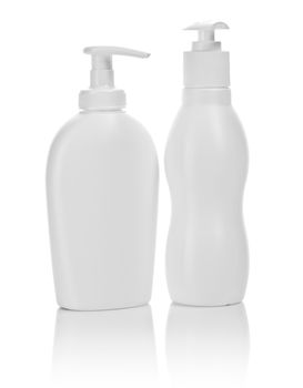 two white cosmetical bottles isolated