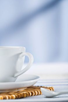 white coffee cup and spoon