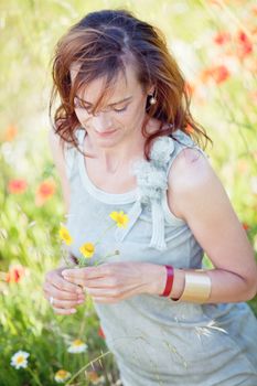 adult brunette woman smiling in summertime outdoor nature