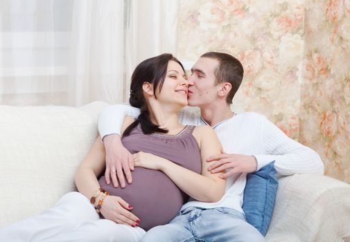 Happy pregnant woman with the husband