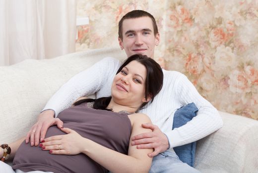 Happy pregnant woman with the husband