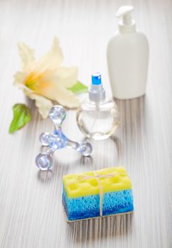 massager bottles sponge soap and flower