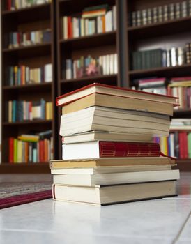 A pile of books with library on the back