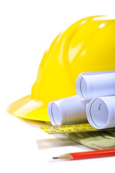 blueprints on glove with ruller and pencil hardhat