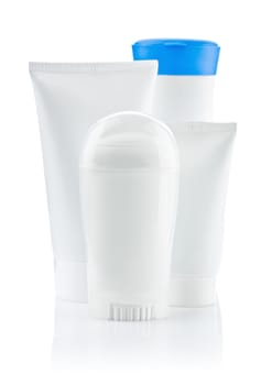 round white bottle and two tube and bottle with blue lid