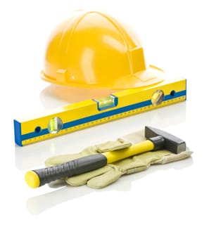 yellow tools and glove