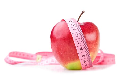 apple and measuring tape isolated