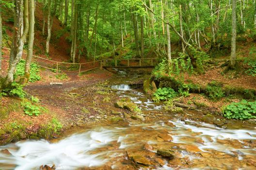 Bridge over mountain river in the mountains