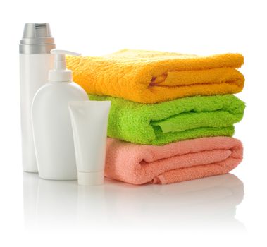 bottles and tube with towels
