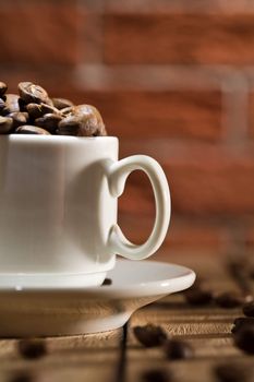 close-up coffee cup with beans