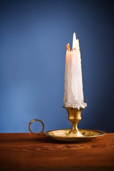 copy space candle on blue background