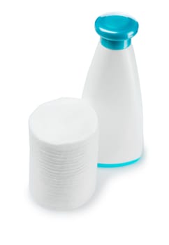 cotton pads and white plastic bottle