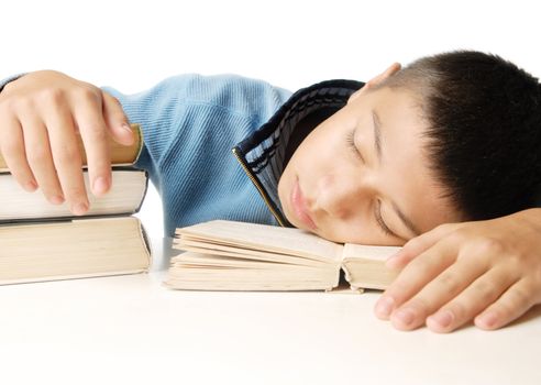 Sleeping boy and educational books on a white background