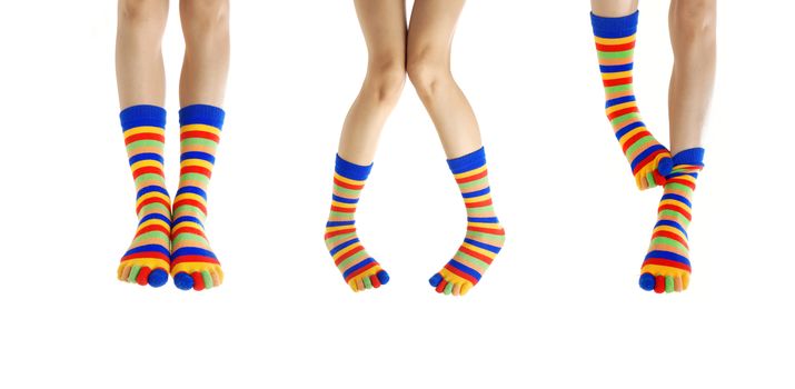 Three couples of woman legs in stripped socks