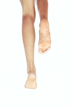 Photo of the running legs without footwear on a white background