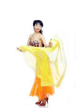 Belly dancer with yellow fabric on a white background