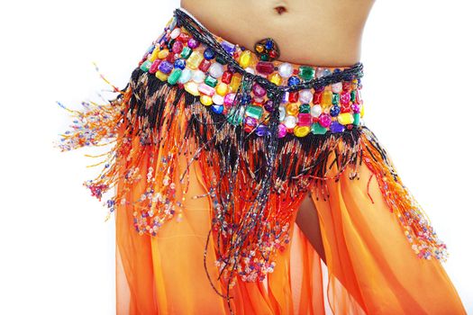 Body part of belly dancer in traditional costume on a white background