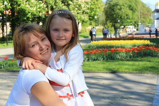 image of mother and daughter are hugging one another