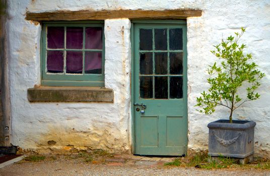 Old weathered door on a derelict outbuild home