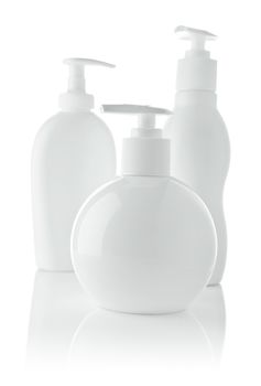 three white spray bottles
