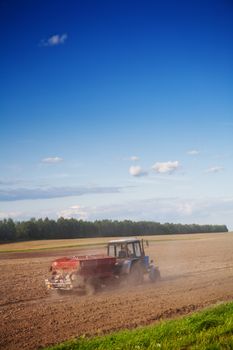 tractor on the cultivated field