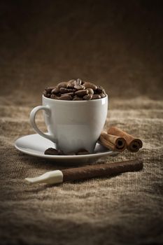 beans in cup and cigar