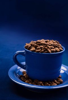 coffee cup with grains on a dark blue background