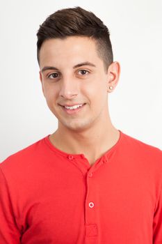 Young and handsome guy posing over white background