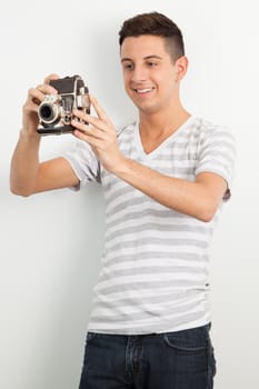 Young man posing against a white background