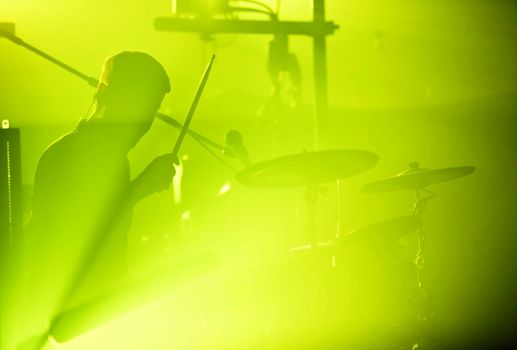 Drumer in silhouette during a concert