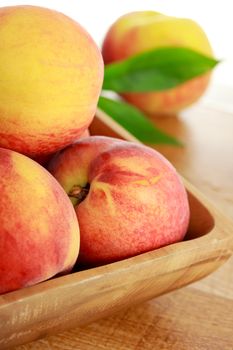 Fresh Peaches in a Wooden Bowl