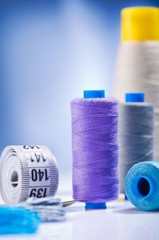 sewing threads and roll of tape