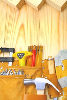 construction tools in belt on wooden boards