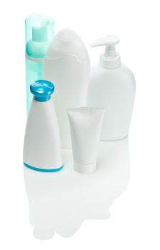 one green and three white care bottles