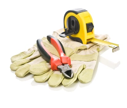 pliers and tapeline on gloves