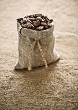 coffee grains in bag on sacking