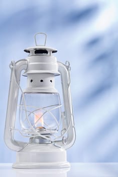 kerosene lamp on blue background