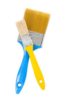 yellow and blue paintbrushes isolated