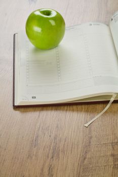 notebook with apple